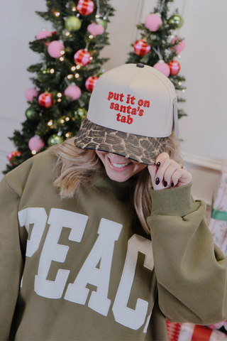 Merry Put It On Santa’s Tab Trucker Hat